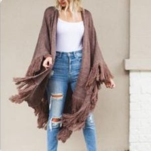 Poncho/kimono with fringe bottom.